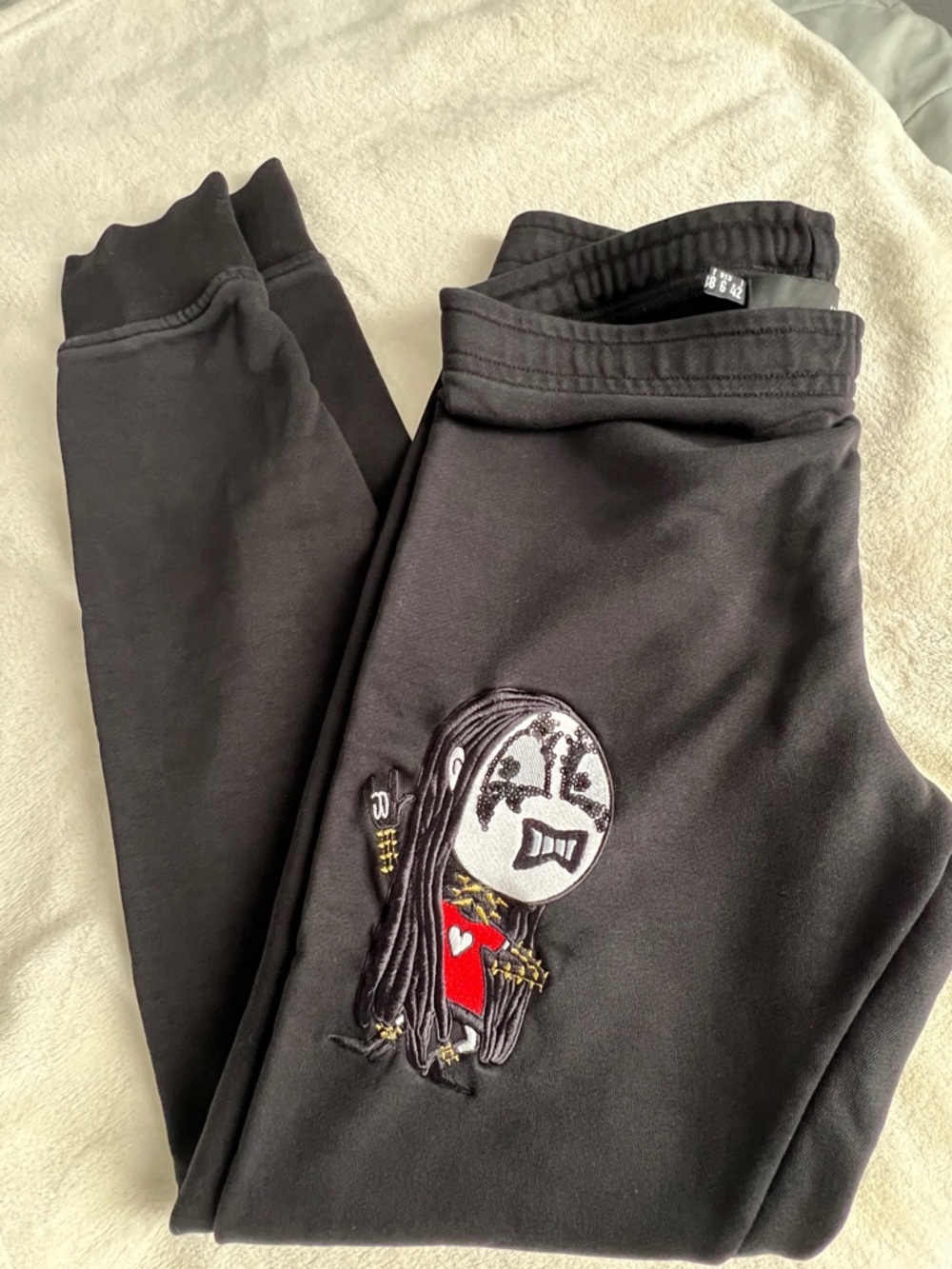 Love Moschino Black Sweatpants with “Sad Teddy” Graphic